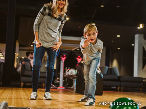 Mother and son bowling at Andy B's Bowl Social in Branson.