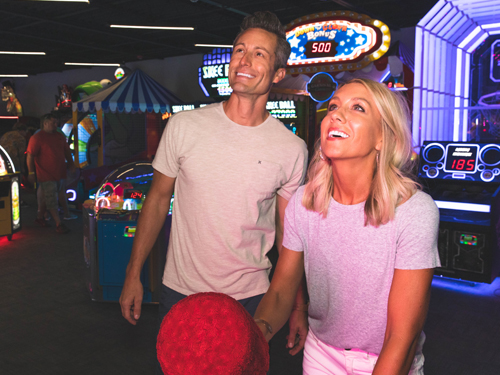 Man and woman on a date at an indoor arcade in Branson.