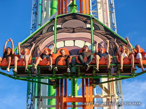 Group of people riding a tall thrill ride in Branson.