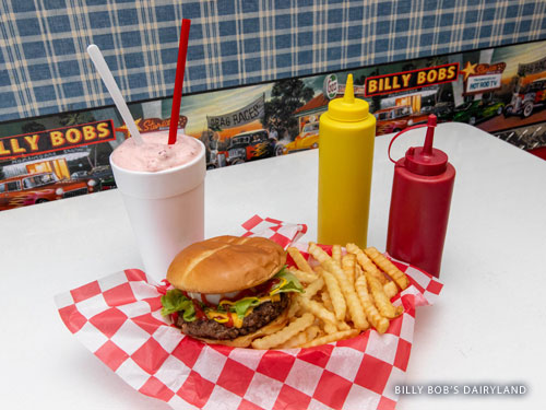 Hamburger, fries and a milkshake sitting on a table in a diner in Branson.