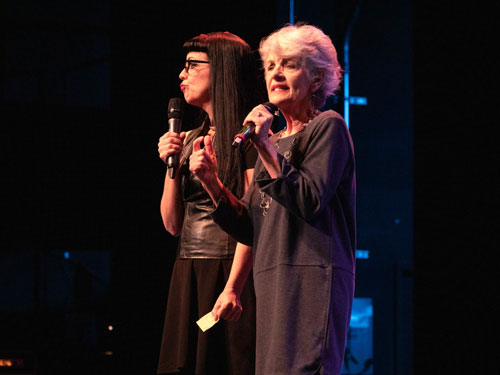Two women performing on live show stage in Branson.