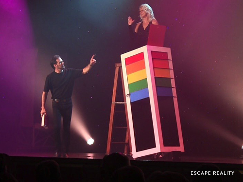 Man and women performing in magic illusion show in Branson.
