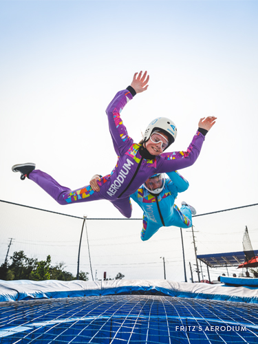 Young girl flying in a aerodium skydiving attraction in Branson.