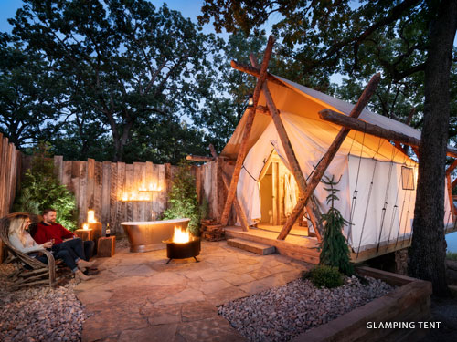 Glamorous camping unit with front porch and fire pit in Branson.