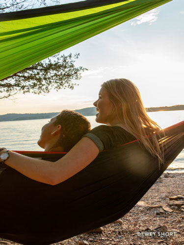 Two girls sitting in a hammock near Table Rock Lake.