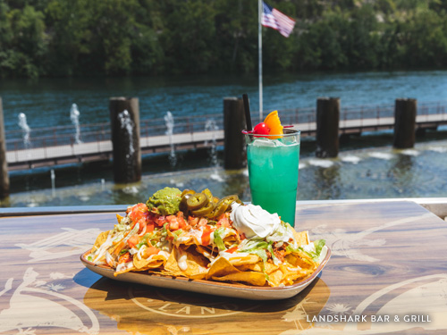 Burger, fries and drink on an outside patio in Branson.