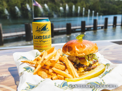 Food and drink served at Landshark Bar and Grill. Patio overlooking Branson Landing fountain show and Lake Taneycomo.