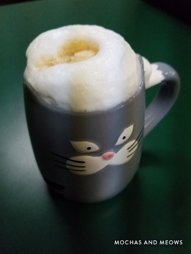 Mug of coffee served at a Branson cat cafe.