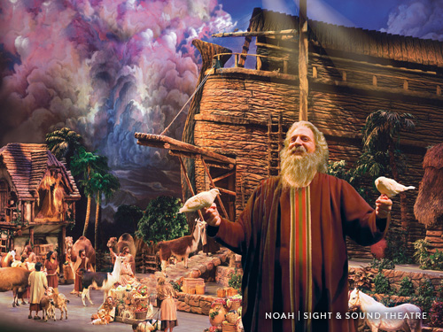 Actor portraying Biblical character performing on a stage with live animals and large props in Branson.