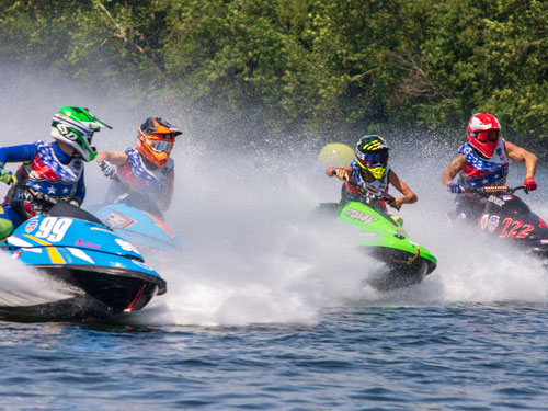 Four powerboat drivers racing in a powerboat race at Branson Landing in Branson.