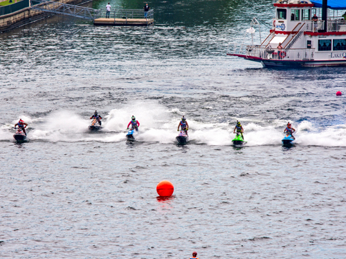 Six powerboat riders racing in a powerboat event on Lake Taneycomo in Branson.
