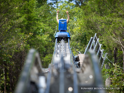 Blue mountain coaster car gliding on the track in Branson.