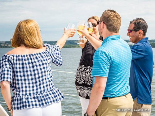 Group of business partners conversing on a catamaran in Branson.