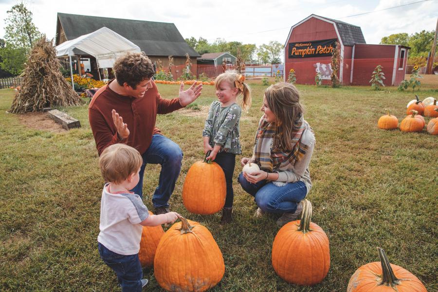 Young family picks out pumpkins