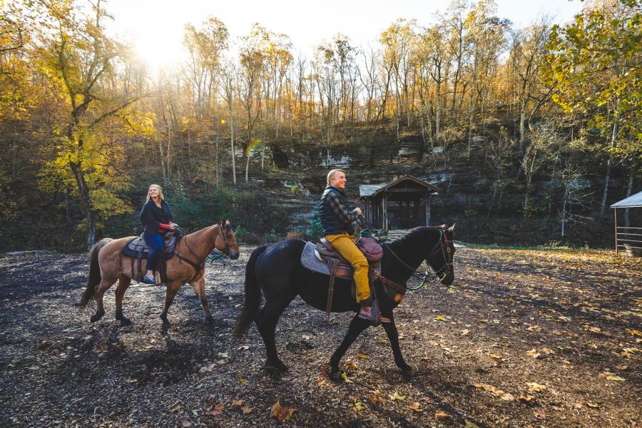 Two people riding horses at Dogwood in Branson Mo