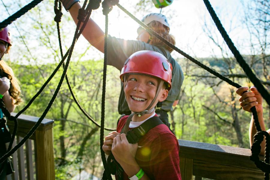 boy ziplining in branson