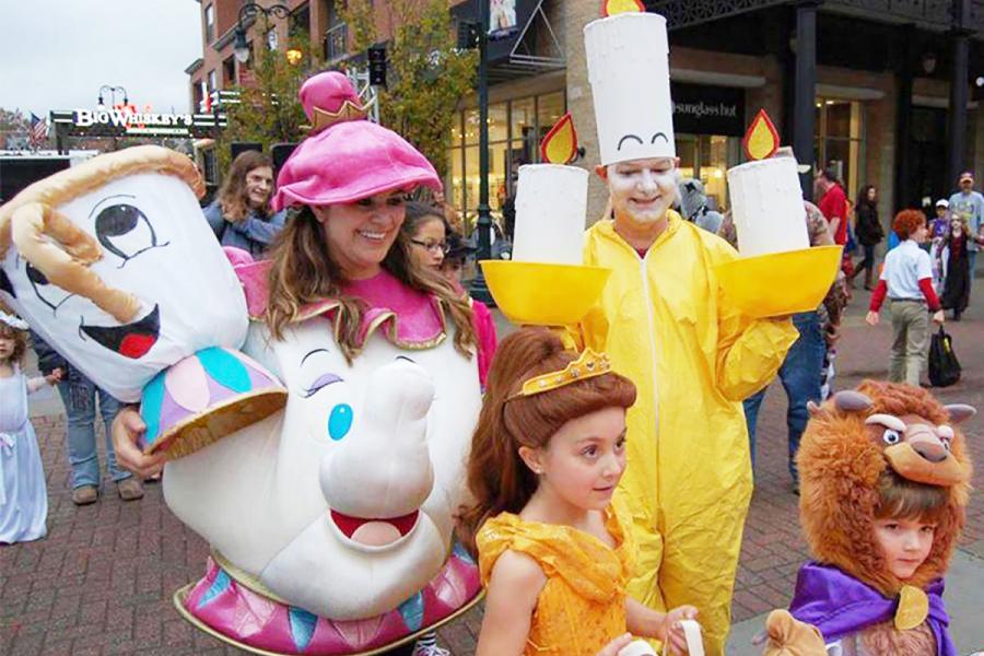 group in costumes trick or treating in downtown branson