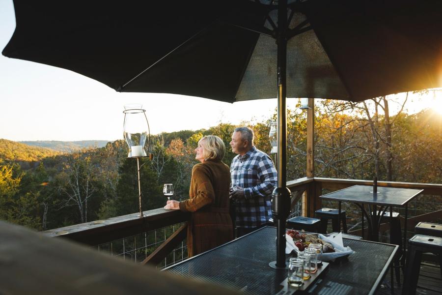 couple on back deck at bear creek winery branson
