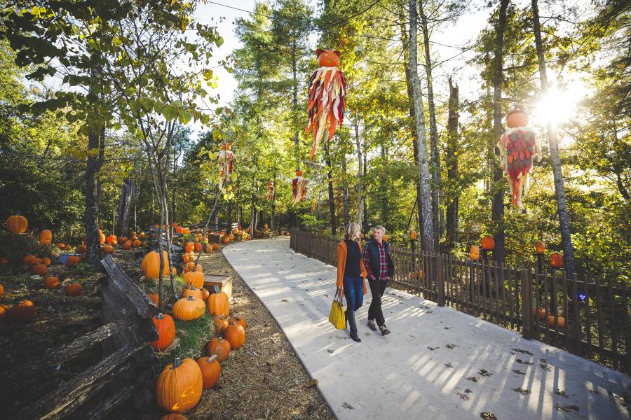 A couple walks through the Harvest Festival at Silver Dollar City