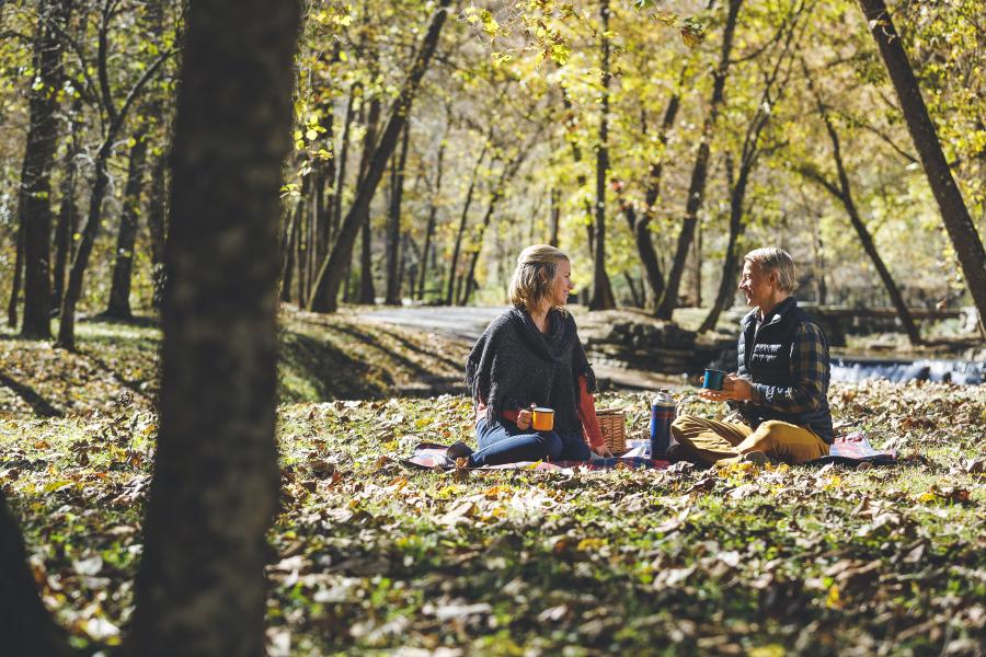 A couple is picnicking at Dogwood Canyon 