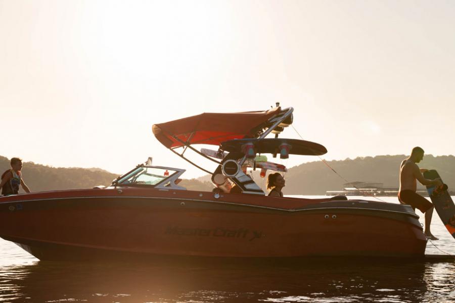 Family enjoying a day on the lake at sunset in Branson.