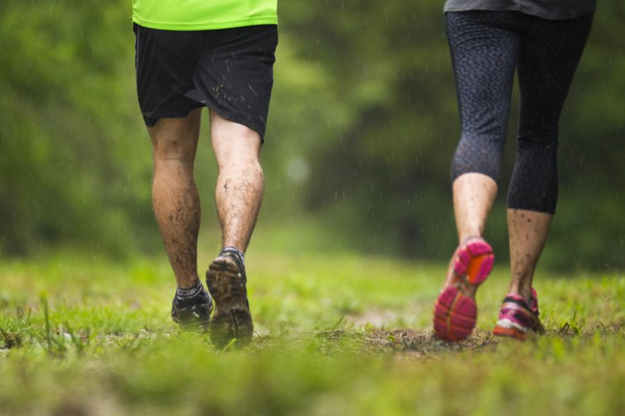 Man and woman jogging on a dirt trail in Branson.