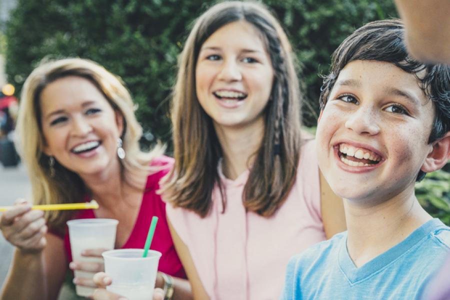 Family laughing while enjoying activities at Silver Dollar City.