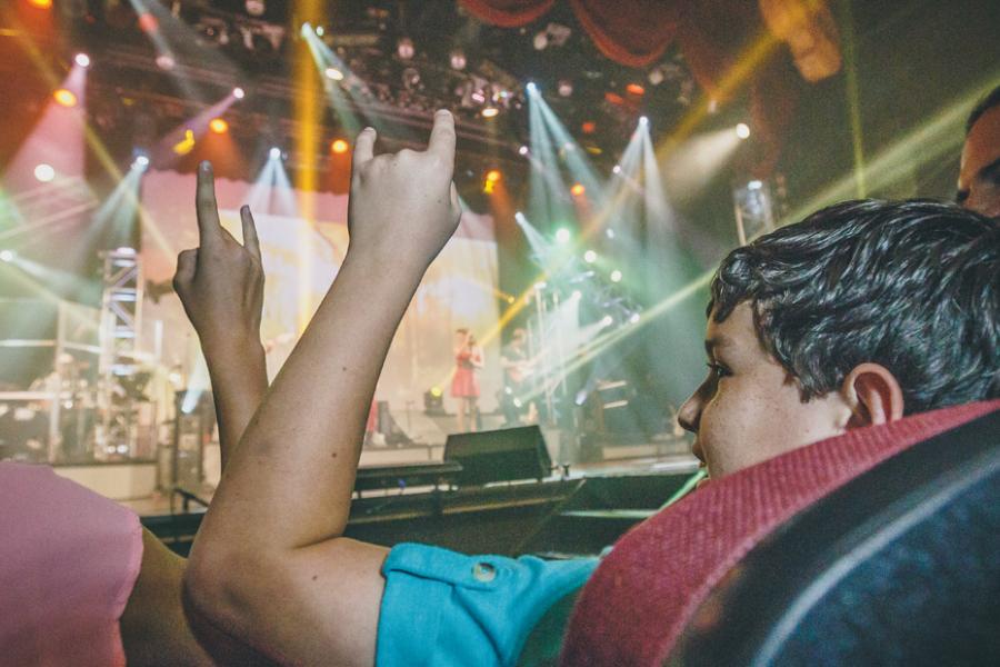 Kids enjoying the entertainment at a live Branson show.