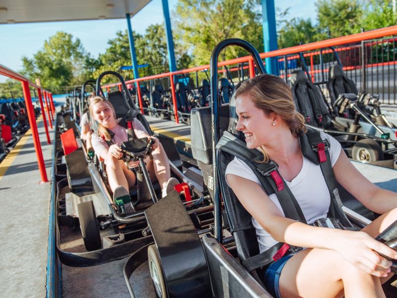 two girls are waiting to drive go-karts at the Track Family Fun park in Branson, MO