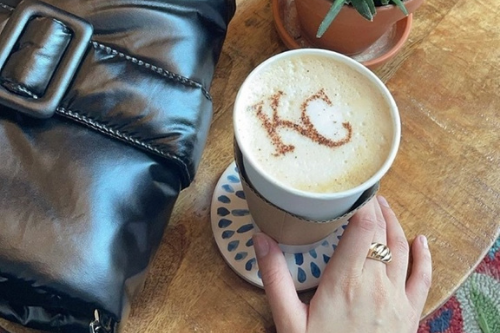 cup of coffee with kansas city logo latte art