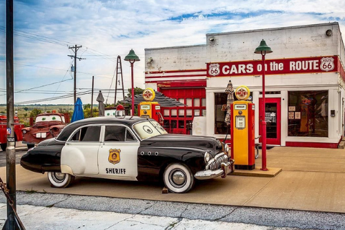 cars on the route historic service station in ks