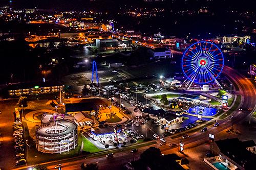 night life on entertainment district in branson featuring branson ferris wheel