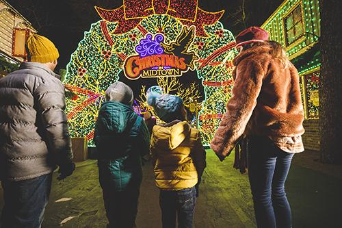 silver dollar city christmas wonderland family walking through light display