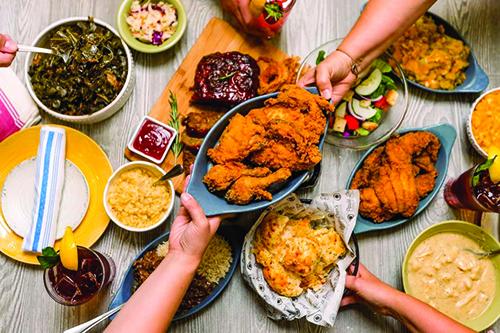 sharing assortment of food on table