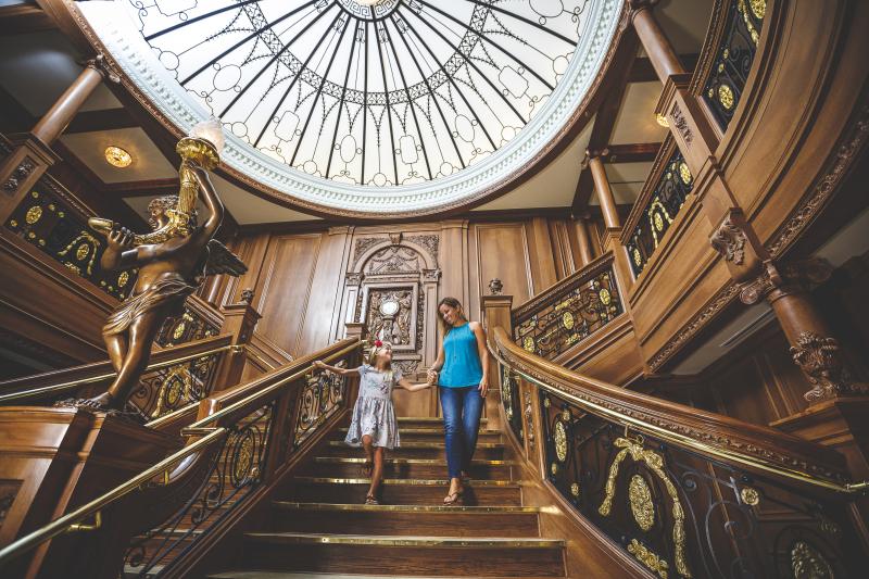 mother and daughter walking down titanic staircase in branson