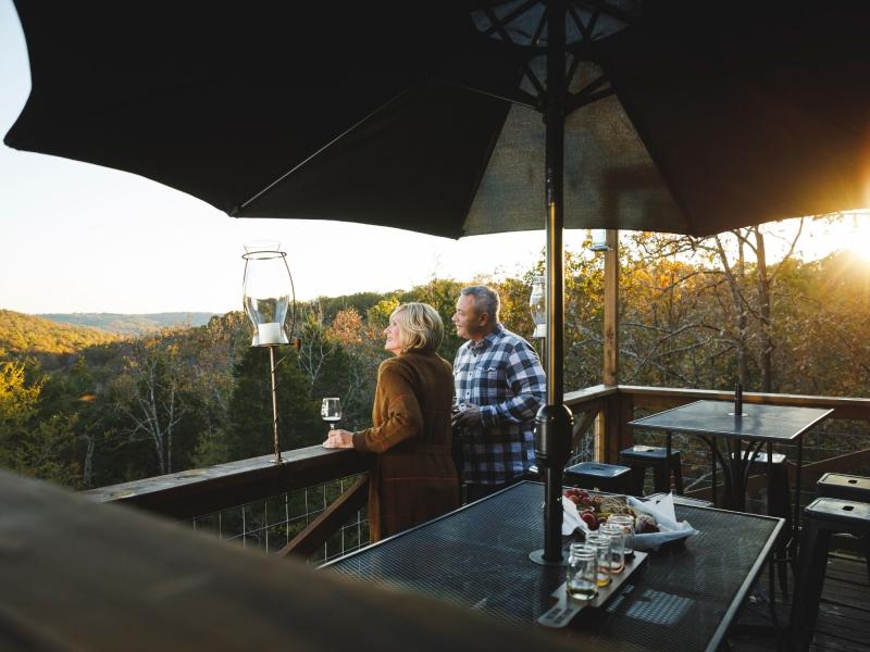 couple on back deck at bear creek winery branson