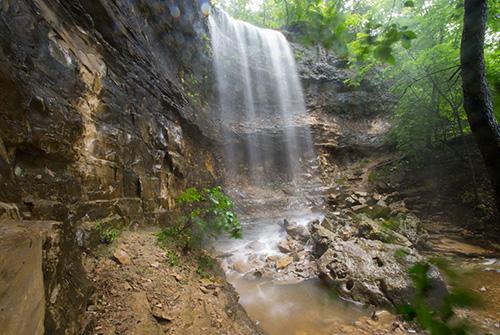 Beneath the waterfall at the Lakeside Wilderness Hiking Trail