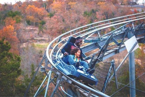 Father and daughter on Runaway Mountain Coaster.