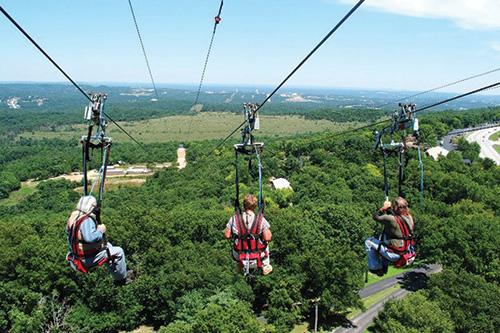 A group launching at 50 miles per hour on the Ziprider at Shepard of the Hills.