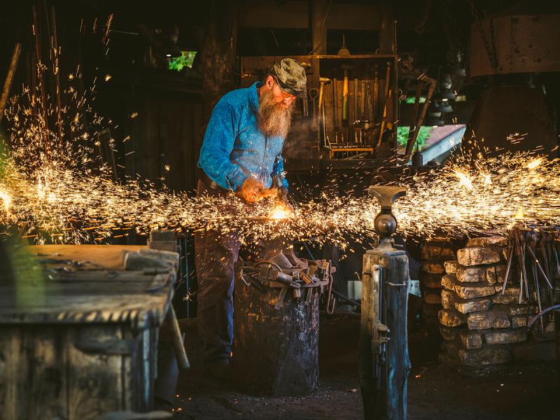 A Blacksmith working on his craft at Silver Dollar City.