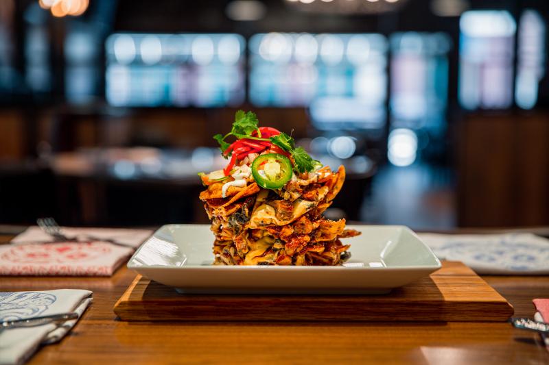 Have signature Trash Can Nachos at Guy Fieri's.