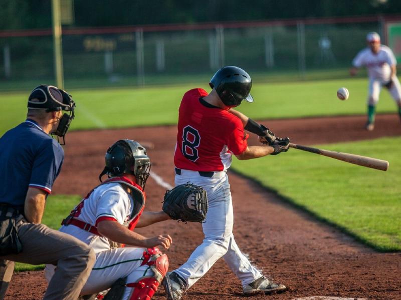 baseball player hitting a ball