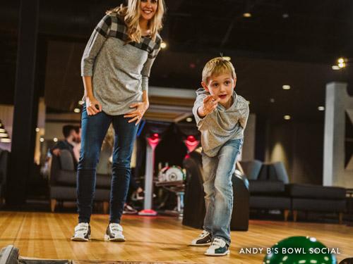 Mother and son bowling at Andy B's Bowl Social in Branson.