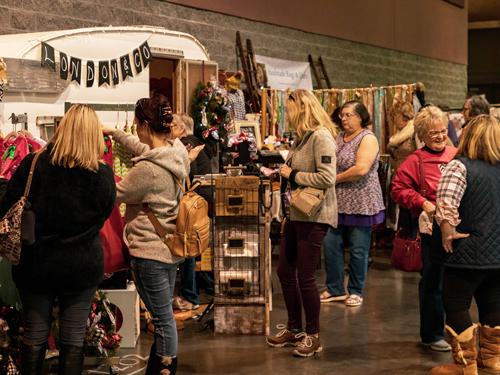 People shopping through over 200 booths of crafts at Branson Market Days. 