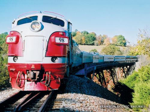 Train touring through scenic Ozark Mountains in Branson.