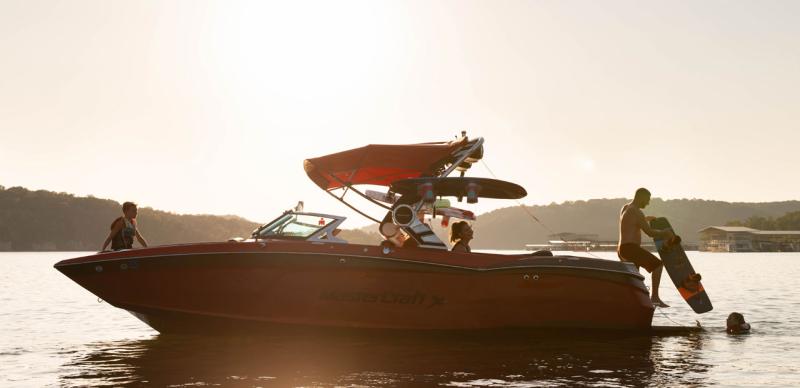 Family enjoying a day on the lake at sunset in Branson.
