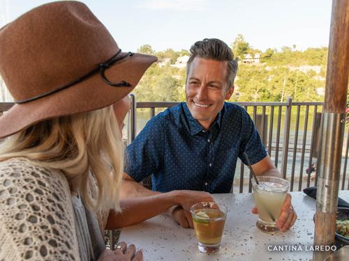 Man and women eating upscale Mexican dishes at Cantino Laredo on Branson Landing.