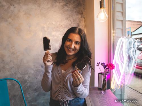 Girl eating an ice cream popsicle at Dreamsicles in Downtown Branson