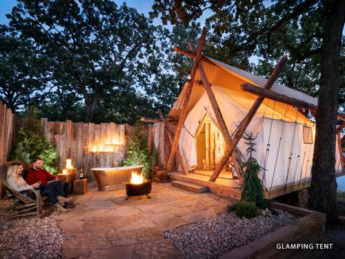 Glamorous camping unit with front porch and fire pit in Branson.