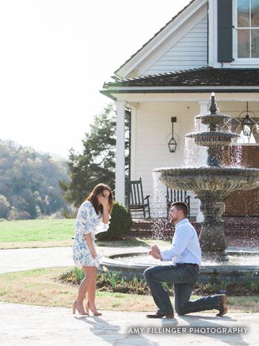 Man on one knee proposing to girlfriend.